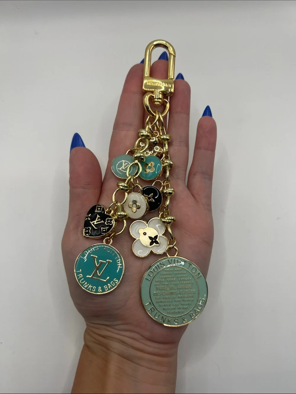 1407. Gold & Teal Multi-Charm Logo Keychain